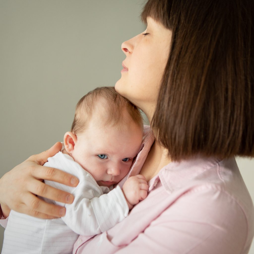 mother holds her baby